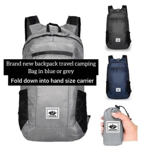 Brand new travel bag in grey, fold down into hand size carrier backpack 2 colors